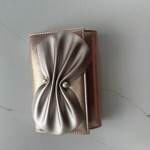 Elegant Metallic Clutch with Satin Bow